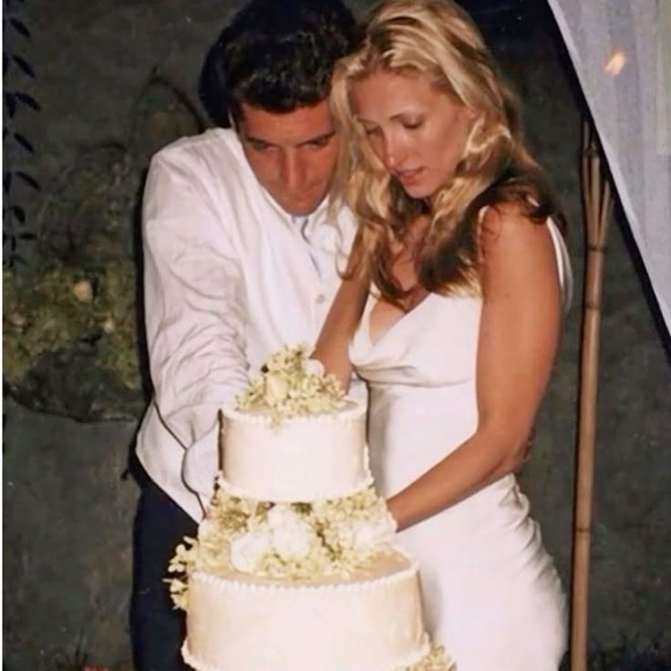 Bride in a satin wedding dress with a draped cowl neckline and sleek fit, inspired by Carolyn Bessette Kennedy style